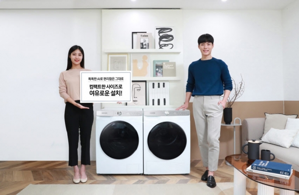 삼성전자 모델이 '그랑데 AI' 10kg 세탁기•9kg 건조기 신제품을 소개하고 있다.